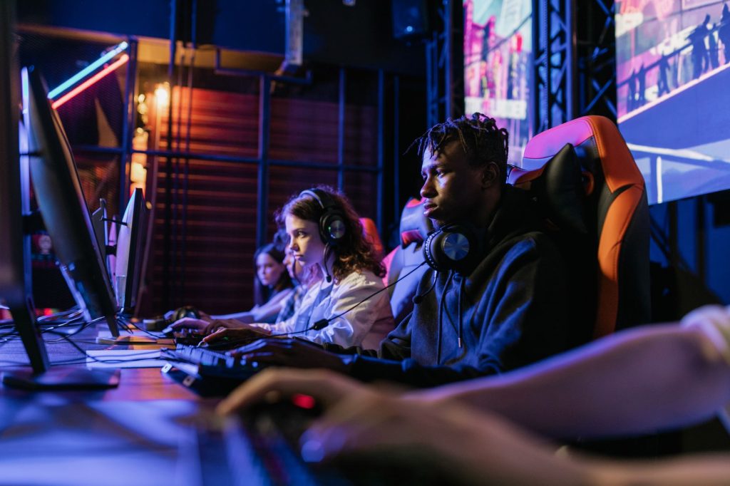 Serious gamers engage in a competitive esports event, highlighting focus and teamwork. — Advanced Graphics in Modern To4d Slo