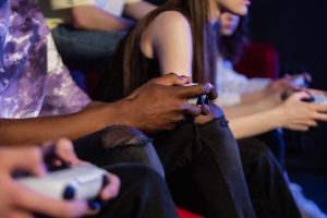 Teens playing video games with controllers, focused and engaged. — Mastering the Game: Strategies for Winning at Slots888