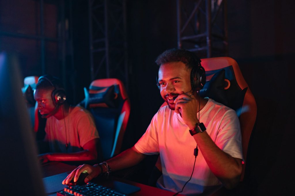 Two gamers immersed in an esports tournament, focused with headsets and keyboards. — Feel the Rush of High-Stakes Act