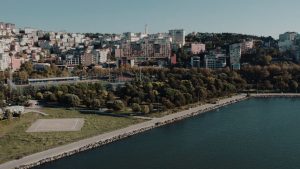 Aerial shot showcasing Istanbul's beautiful waterfront and urban landscape on a sunny day. — The Lucrative World of Thai Onli