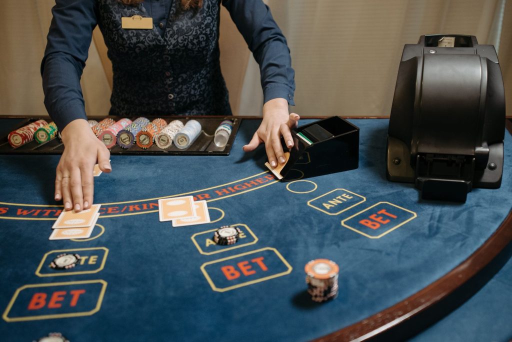 Casino dealer organizing cards and chips on a gaming table during a game. — Wish To Switch To Way Without A Doubt? Try Variou