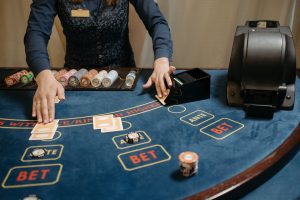 Casino dealer organizing cards and chips on a gaming table during a game. — Wish To Switch To Way Without A Doubt? Try Variou