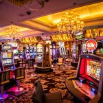 A vibrant and colorful interior of a casino showing various slot machines and gaming areas.