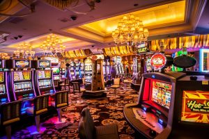 A vibrant and colorful interior of a casino showing various slot machines and gaming areas.