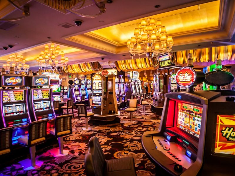 A vibrant and colorful interior of a casino showing various slot machines and gaming areas.